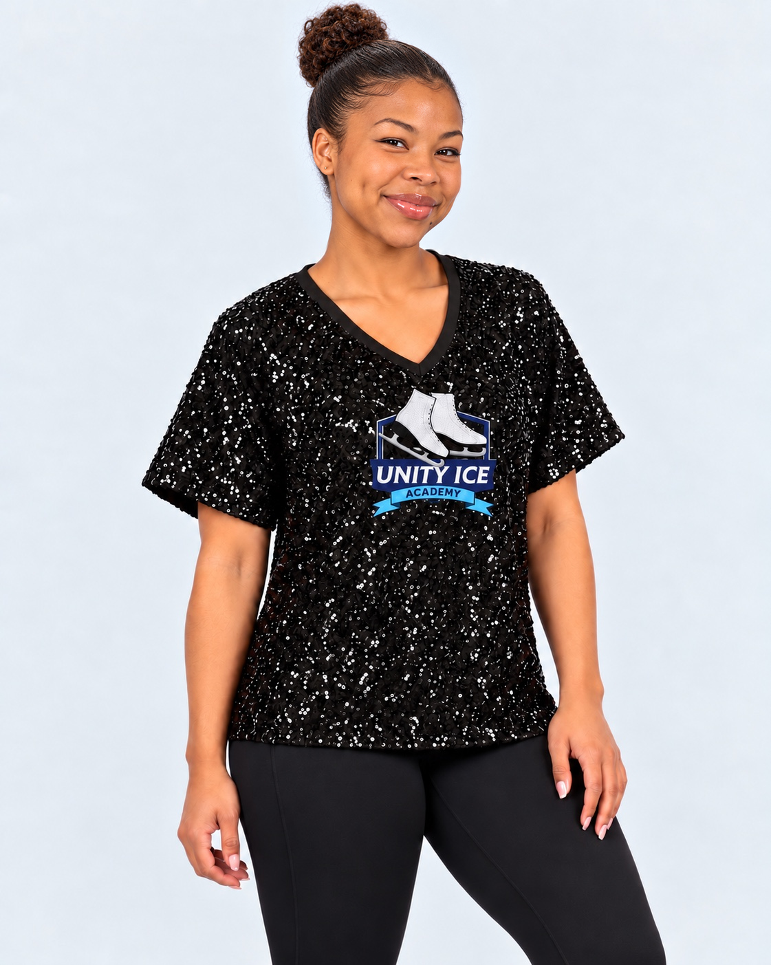 AI-generated mockup of Starr Andrews with a textured high bun wearing the slightly oversized black Unity Ice Academy Oksana sequin shirt.