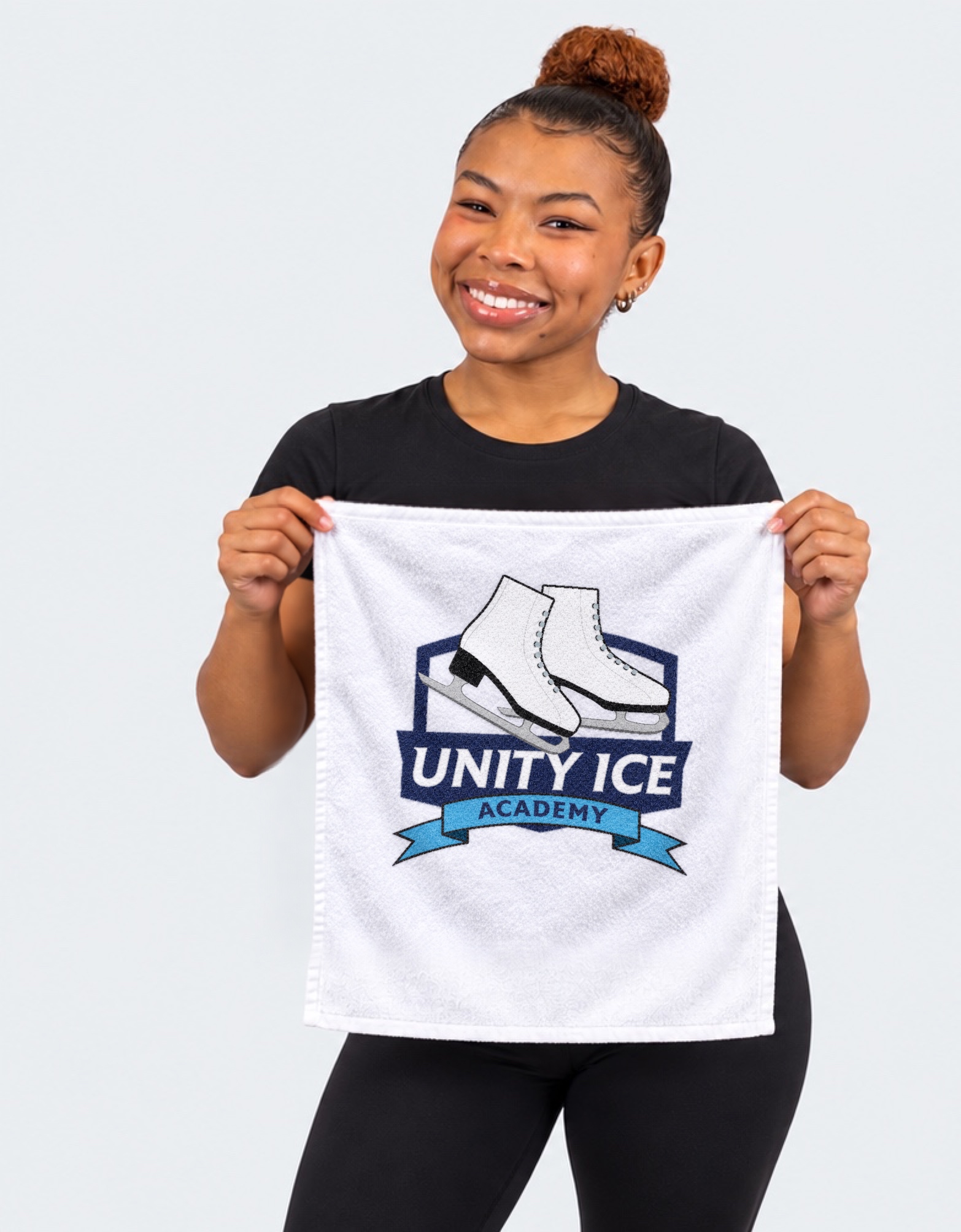 AI-generated mockup of Starr Andrews holding a white Unity Ice Academy rally towel.