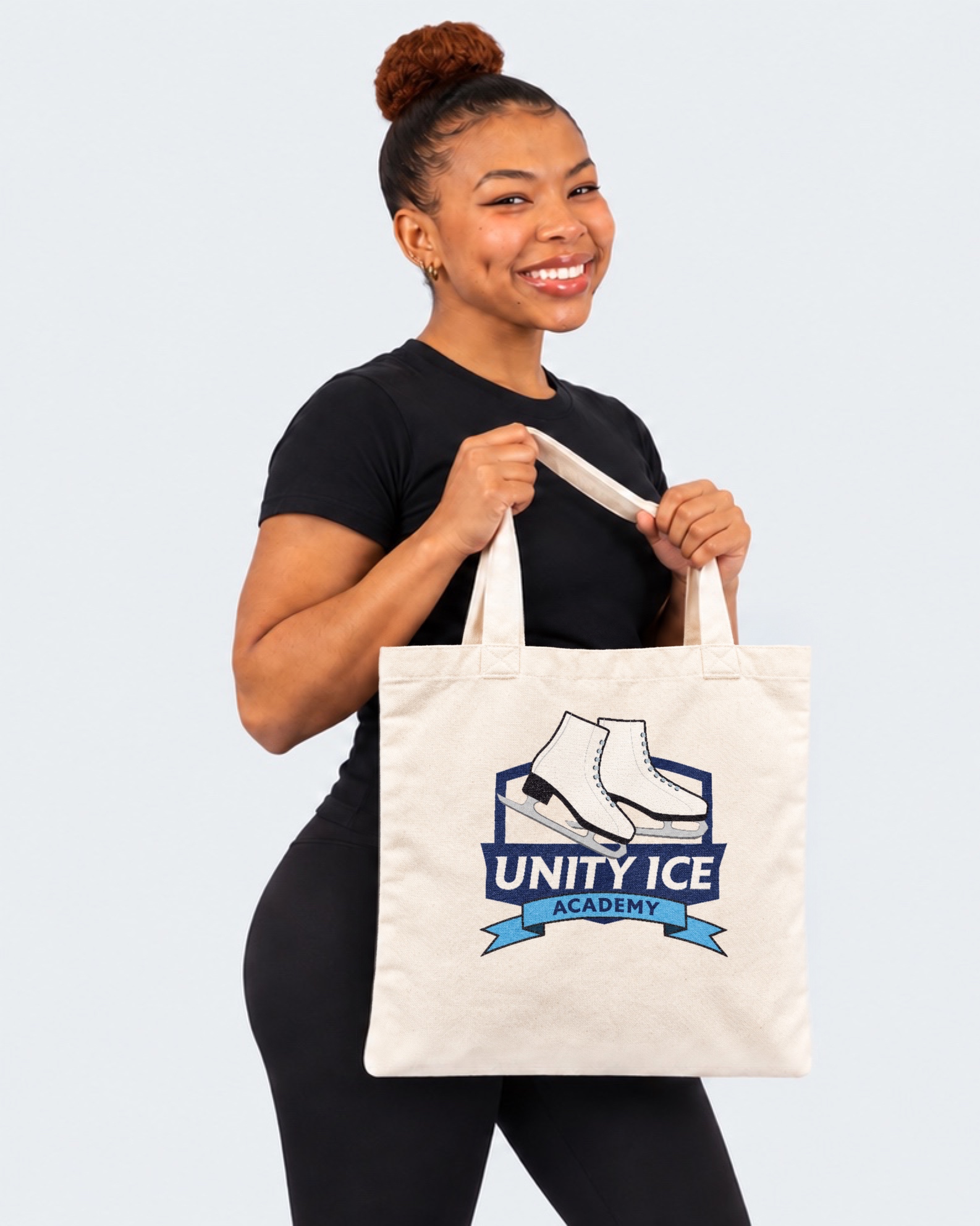 AI-generated mockup of Starr Andrews holding a natural canvas Unity Ice Academy tote bag.