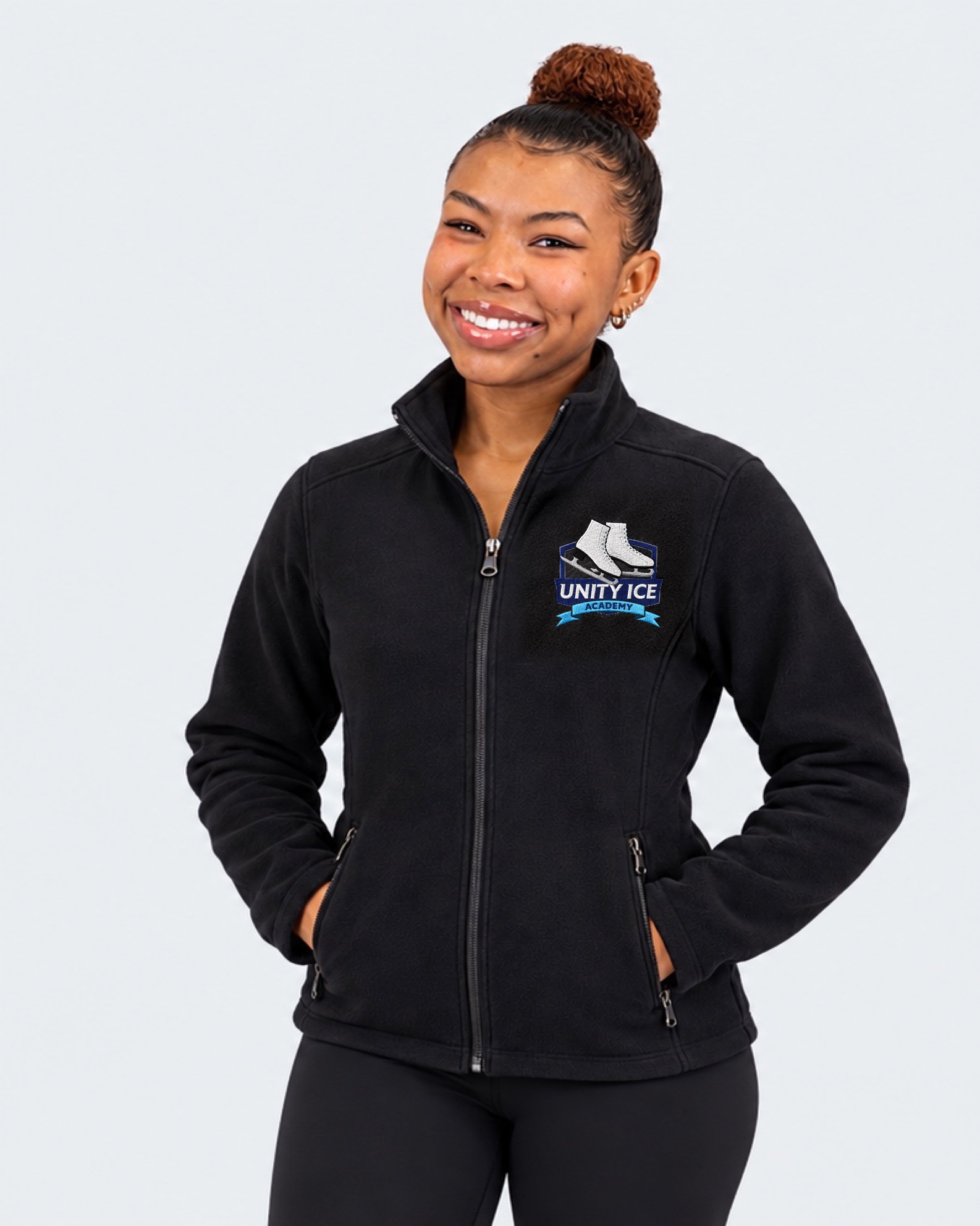AI-generated mockup of Starr Andrews wearing a black youth fleece jacket with the Unity Ice Academy crest.